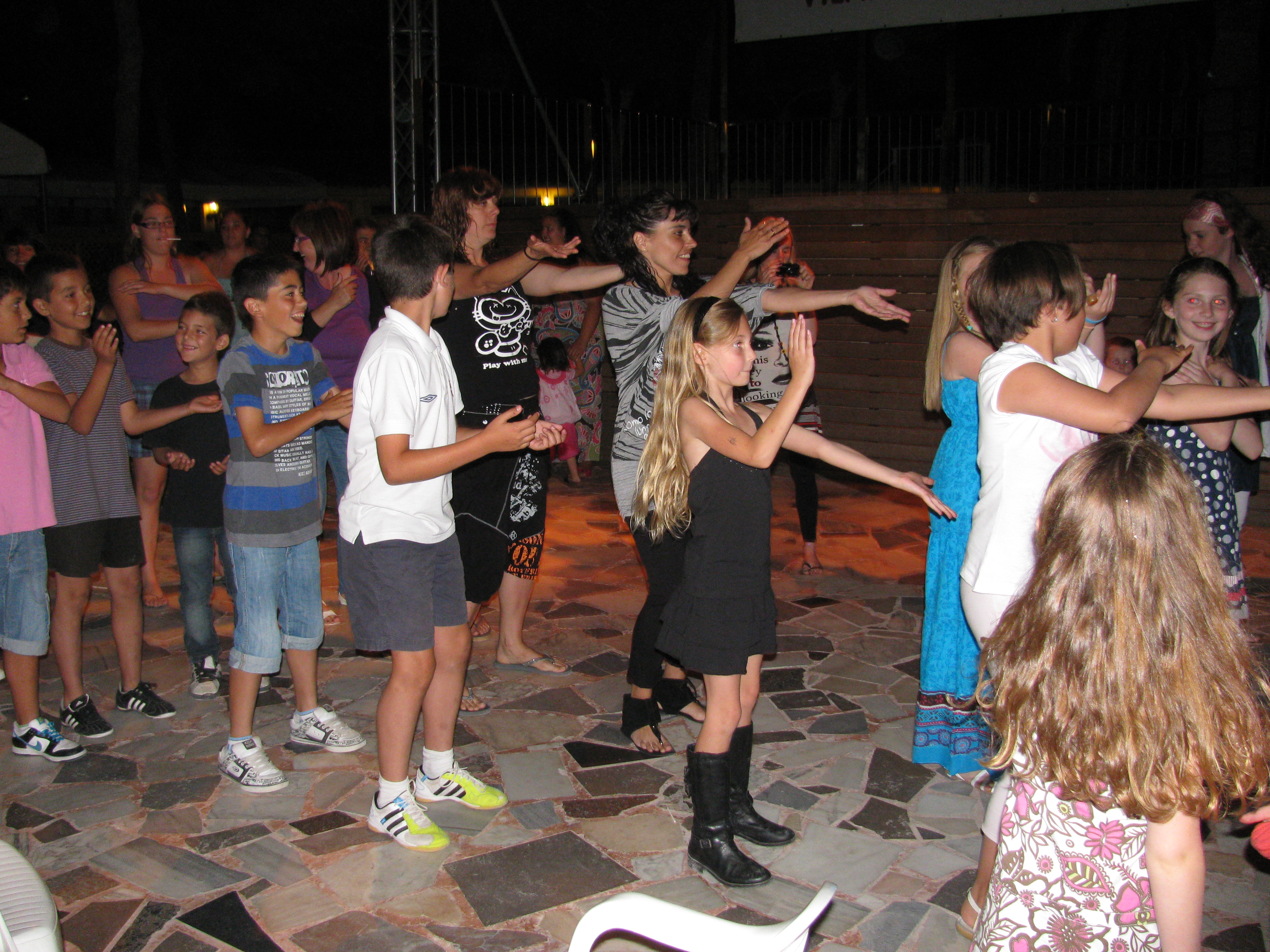 family fun= kids doing macarena at kids disco in Europe family fun= kids doing macarena at kids disco in Europe